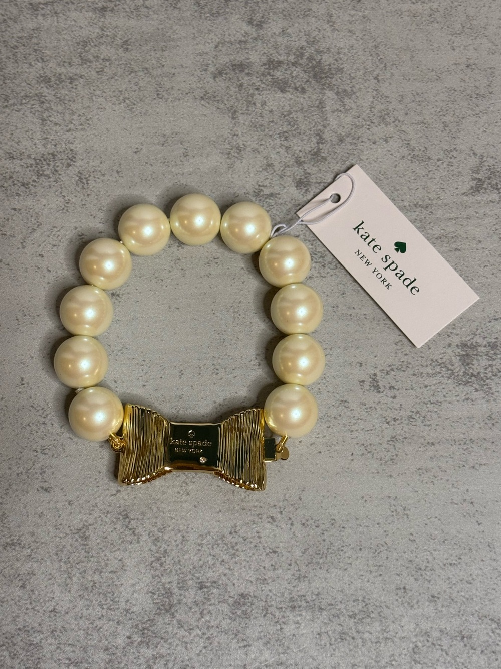 Kate Spade All Wrapped Up Faux Pearl Bracelet with Gold Bow Closure - Picture 4 of 10